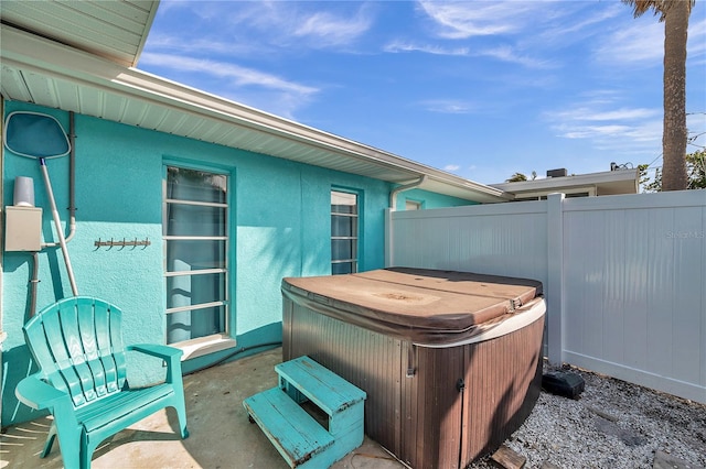 view of patio / terrace featuring a hot tub