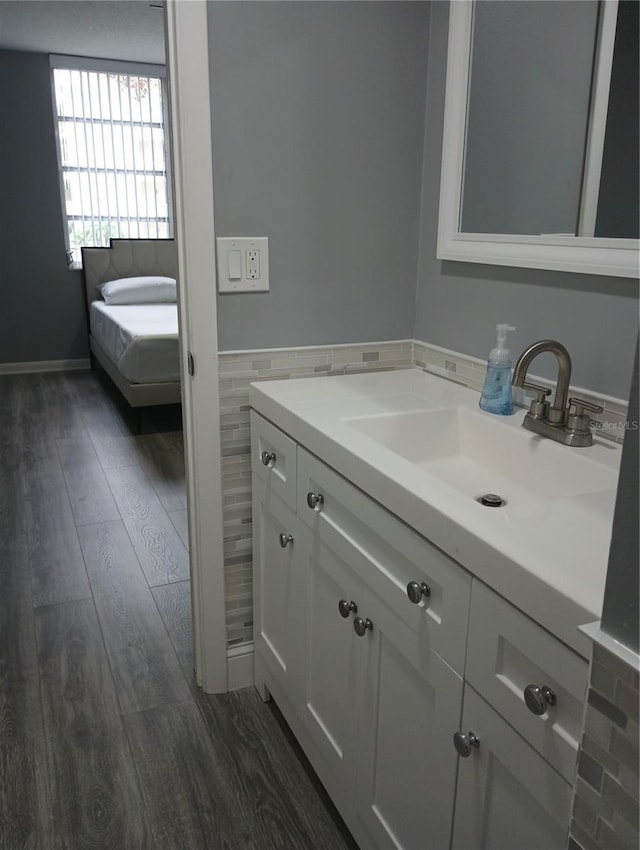 bathroom with vanity and hardwood / wood-style floors