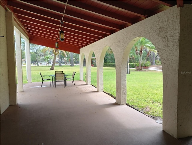 surrounding community featuring a patio area and a lawn