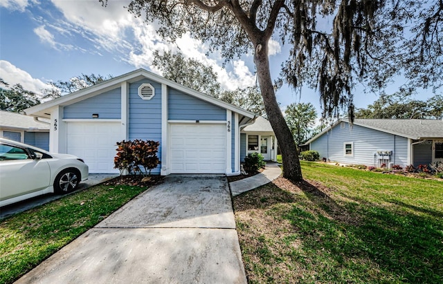 single story home featuring a garage and a front yard