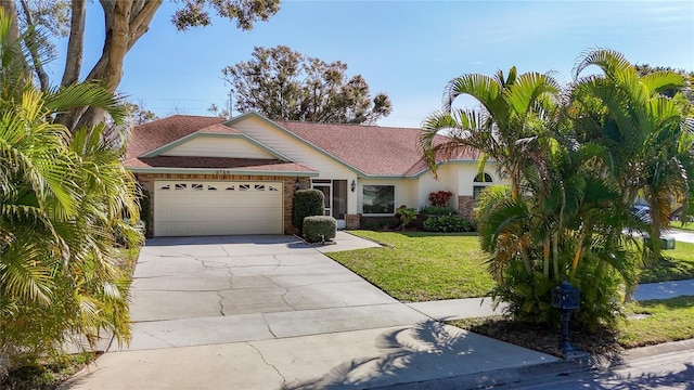 view of front facade featuring a garage and a front lawn