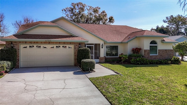 view of front of property featuring a garage and a front yard