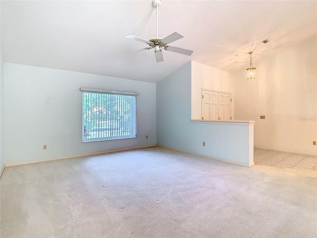 unfurnished living room with ceiling fan, high vaulted ceiling, and light carpet