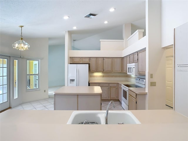 kitchen with sink, a center island, high vaulted ceiling, light tile patterned floors, and white appliances