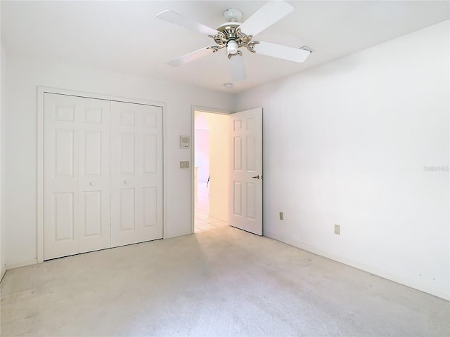 unfurnished bedroom featuring a closet and ceiling fan