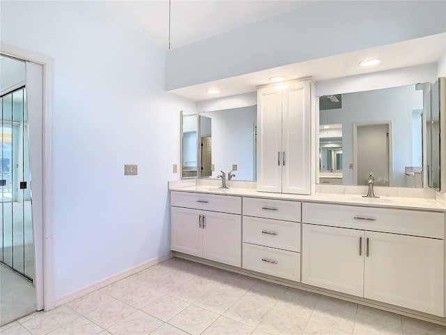 bathroom with vanity and tile patterned floors