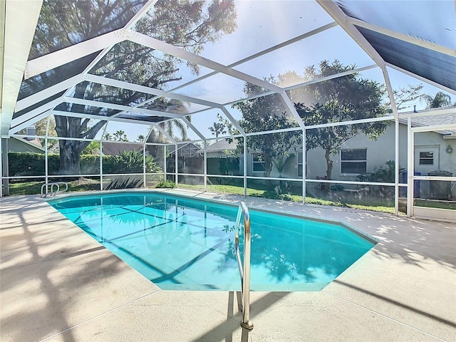 view of pool featuring a patio and a lanai