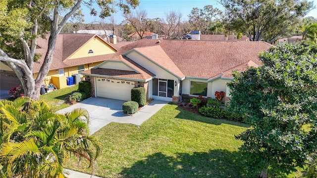 view of front facade featuring a garage and a front yard