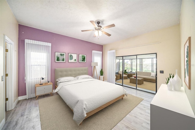 3013 Ridgevale Cir, Valrico, FL 33596 - bedroom featuring light wood-type flooring, ceiling fan, baseboards, and a textured ceiling