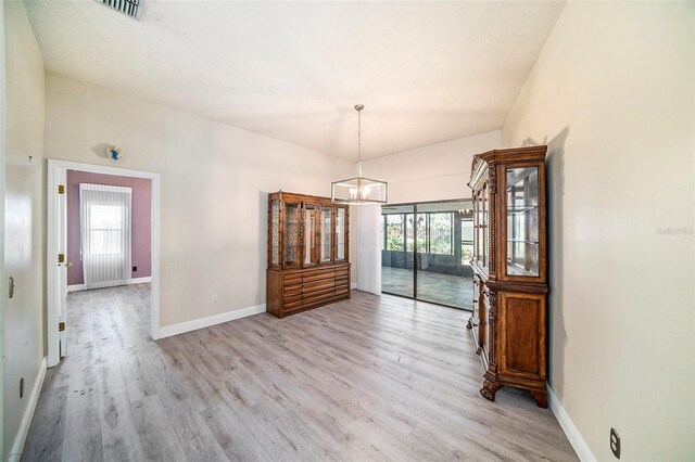 3013 Ridgevale Cir, Valrico, FL 33596 - unfurnished dining area with light wood-style flooring, an inviting chandelier, baseboards, and visible vents