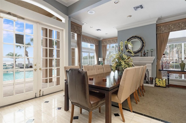 dining area with light tile patterned floors, recessed lighting, visible vents, french doors, and crown molding