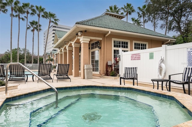 view of pool featuring a patio, a swimming pool, and fence