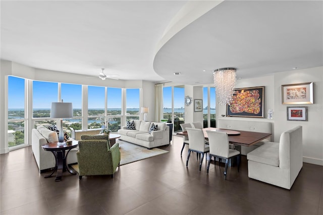 450 Knights Run Ave Unit 1704, Tampa, FL 33602 - living room featuring a chandelier, a ceiling fan, and a water view