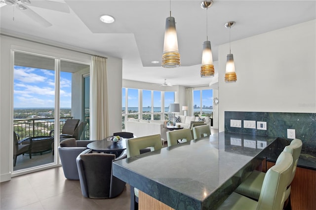 450 Knights Run Ave Unit 1704, Tampa, FL 33602 - tiled dining space featuring ceiling fan