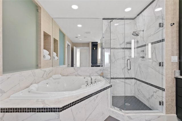 450 Knights Run Ave Unit 1704, Tampa, FL 33602 - bathroom with a garden tub, a marble finish shower, and recessed lighting