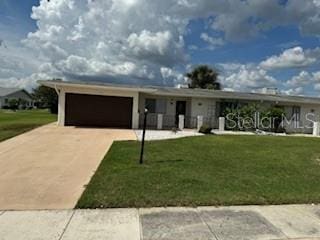 ranch-style house with a front lawn