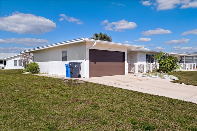 view of front of house featuring concrete driveway, an attached garage, brick siding, and a front yard