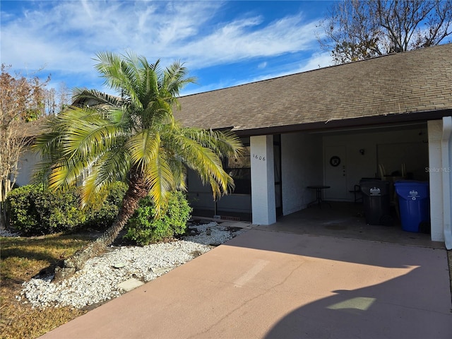 view of side of home featuring a carport