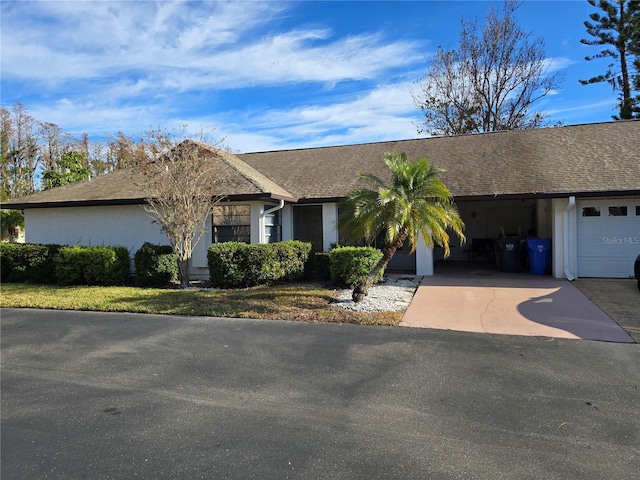 ranch-style home with a garage