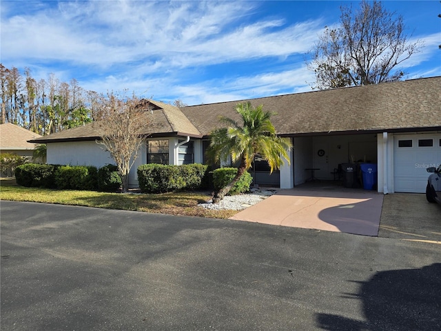 single story home featuring a garage