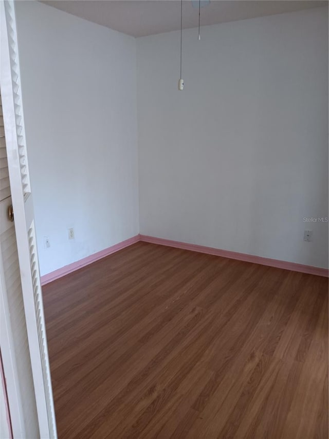 empty room featuring dark hardwood / wood-style floors