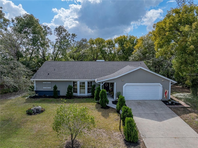 ranch-style home with a front lawn and a garage