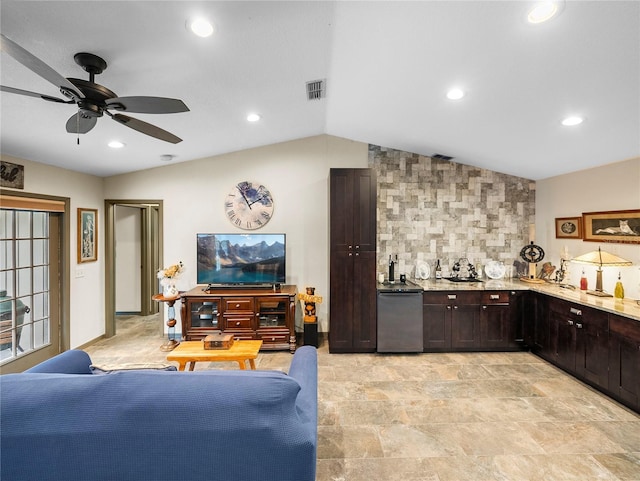 interior space with ceiling fan, vaulted ceiling, and indoor bar