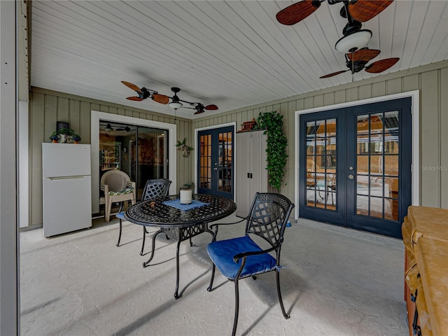 view of patio / terrace featuring ceiling fan and french doors