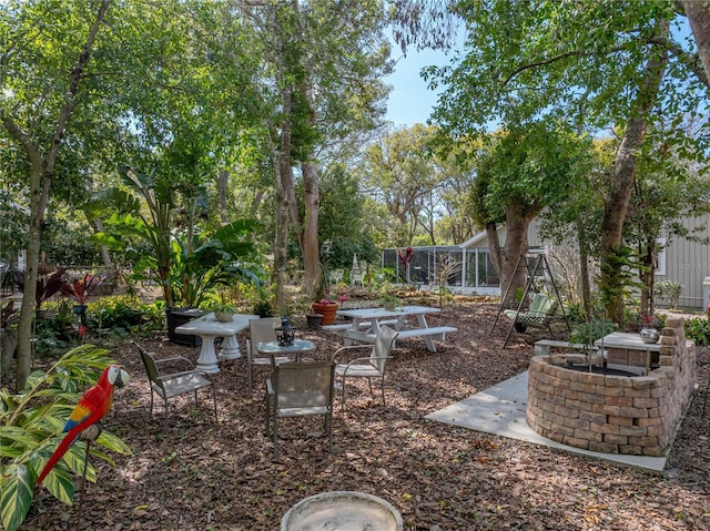 view of yard featuring a patio and a lanai