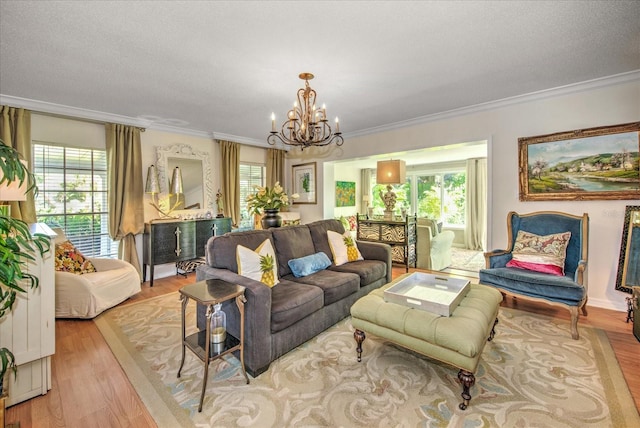 living room with ornamental molding, light wood-type flooring, and a wealth of natural light