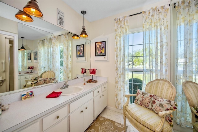 bathroom with vanity and tile patterned flooring