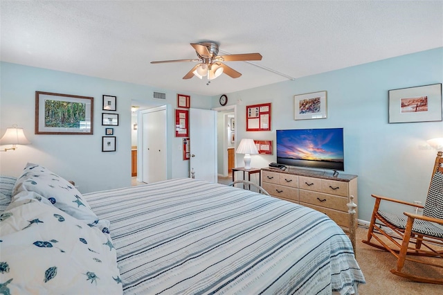 bedroom with ceiling fan and carpet flooring