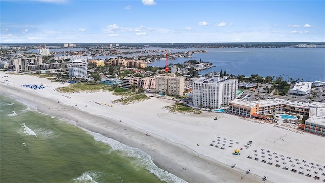 birds eye view of property with a view of the beach and a water view