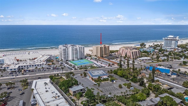 drone / aerial view featuring a water view and a beach view