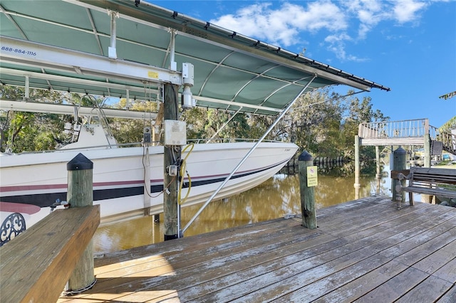 dock area featuring a water view and boat lift