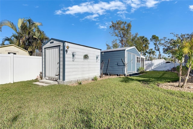 view of shed with a fenced backyard