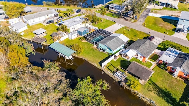 drone / aerial view with a water view and a residential view