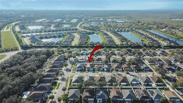 aerial view featuring a water view and a residential view