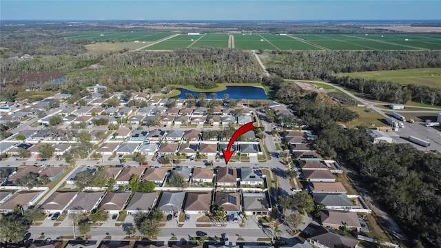 bird's eye view featuring a water view and a residential view