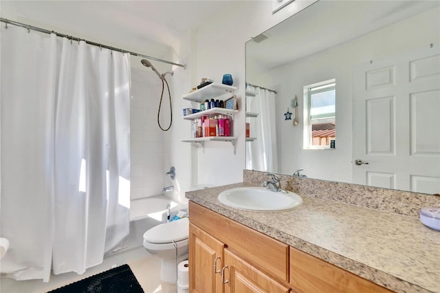 bathroom featuring toilet, shower / bath combo, and vanity