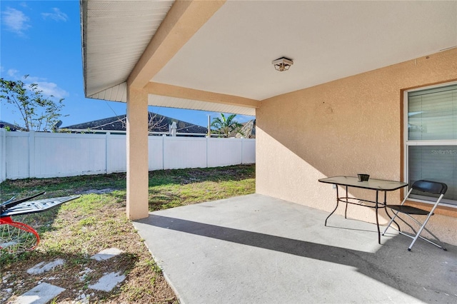 view of patio with fence