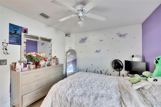 bedroom with visible vents and a ceiling fan