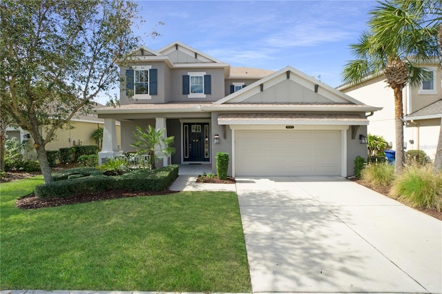 craftsman house featuring concrete driveway, covered porch, board and batten siding, a front yard, and a garage