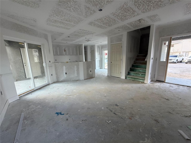 unfurnished living room featuring a wealth of natural light