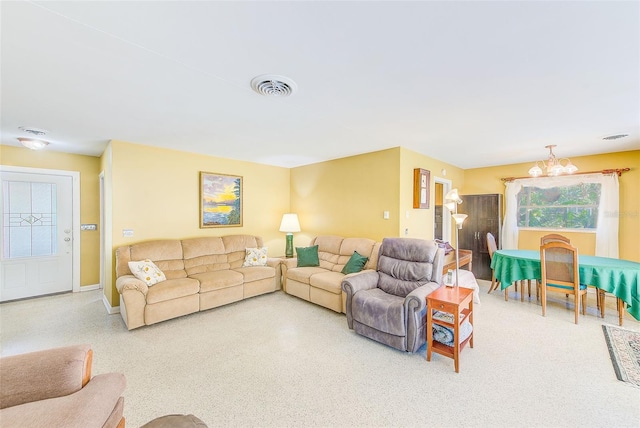 living room with a notable chandelier