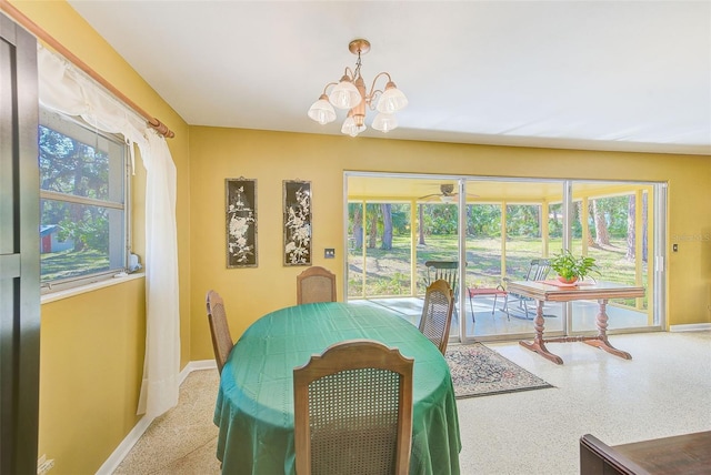 dining area featuring an inviting chandelier and plenty of natural light