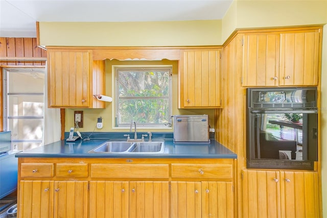 kitchen with oven and sink