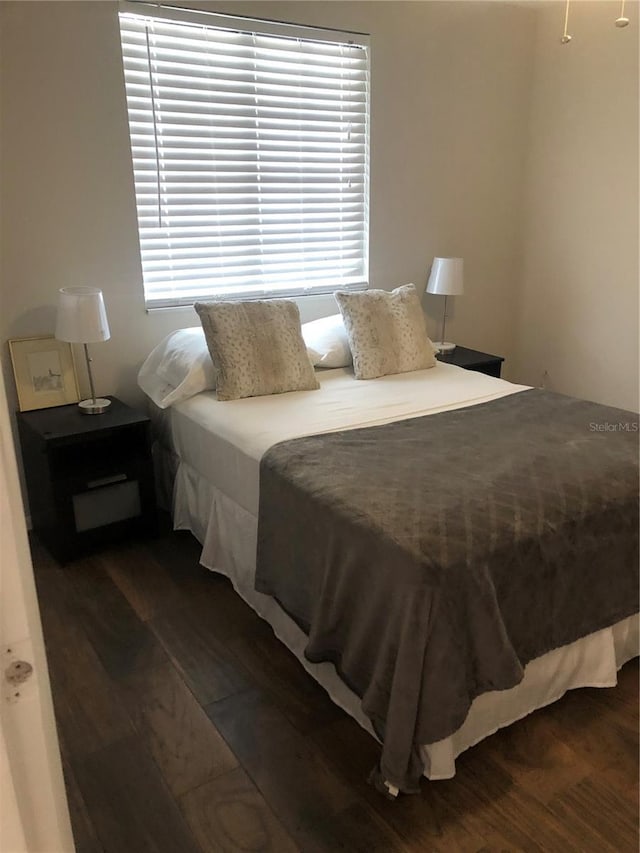 907 Fruitland Ave, Bradenton, FL 34207 - bedroom featuring dark wood-style flooring