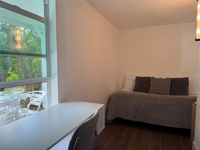 907 Fruitland Ave, Bradenton, FL 34207 - bedroom with lofted ceiling and dark wood-style flooring