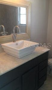 907 Fruitland Ave, Bradenton, FL 34207 - bathroom featuring toilet and vanity